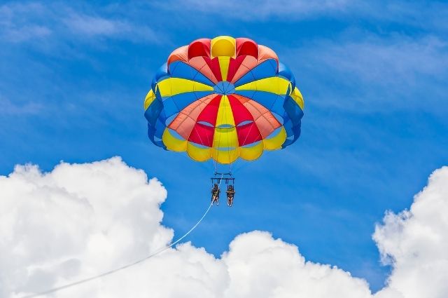 Parasail flying high in the sky over Destin