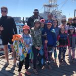 Group after a successful dolphin sightseeing tour in Destin
