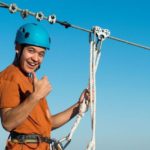 preparing to zipline at Baytowne Adventure Zone